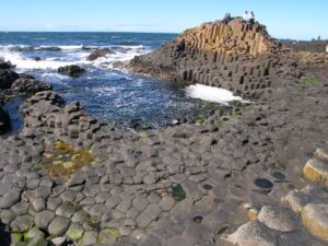 Another image of remote viewing target 210120418 with people to show the scale of the Giant's Causeway
