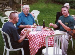 Ingo Swann (L), Lyn Buchanan, and the author's son, James at the Puthoff's dinner party during the 2002 Remote Viewing Conference